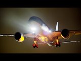 Thrilling Shots of Planes Landing Overhead at Night