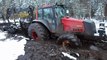Valtra forestry tractor in mud, wet forest conditions