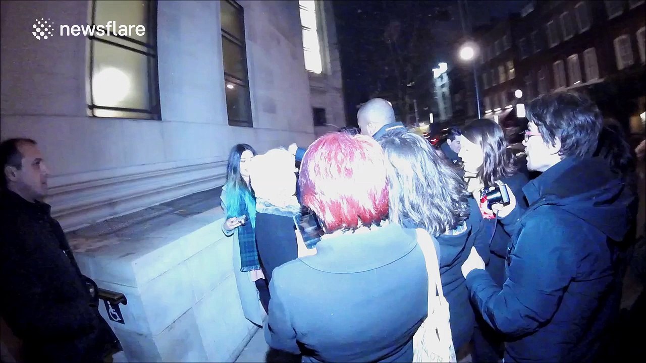 Oscar Isaac poses for pictures with fans in London