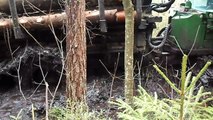 Forwarder John Deere 1110D in deep mud, extreme offroad