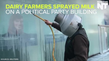 Dairy Farmers Spray Milk At A Building In Protest