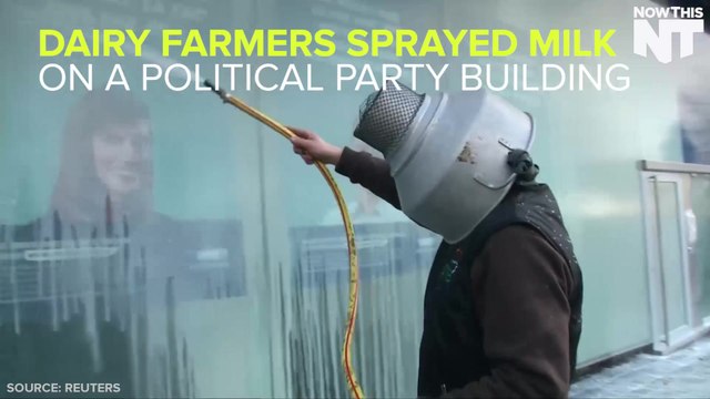 Dairy Farmers Spray Milk At A Building In Protest