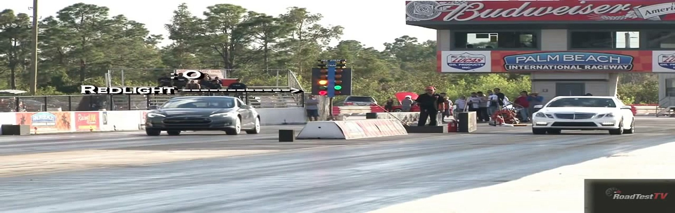 650 HP E63 Bi Turbo AMG vs Tesla Model S 85 KW Drag Race Video Road Test TV