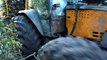 Valtra forestry tractor with big full trailer working in difficult conditions