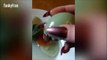 Watch bizarre moment woman crack open egg and finds another one INSIDE it (FULL HD)