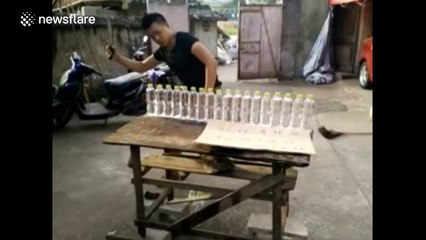 Knife artist chops 16 water bottles in half all at once