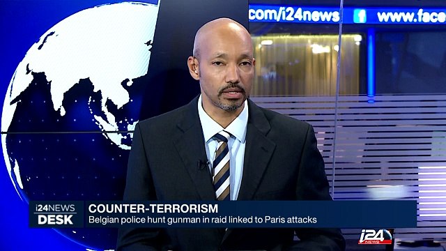 Belgian police hunt gunman in raid linked to Paris attacks