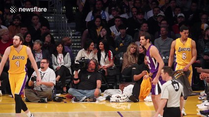 Kendall and Kylie Jenner sit courtside at the Lakers