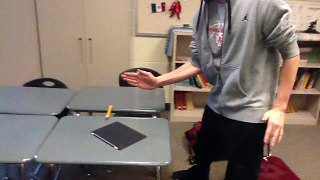 Man trying to karate chop through 4 pencils