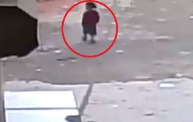Kid trips up & gets ran over