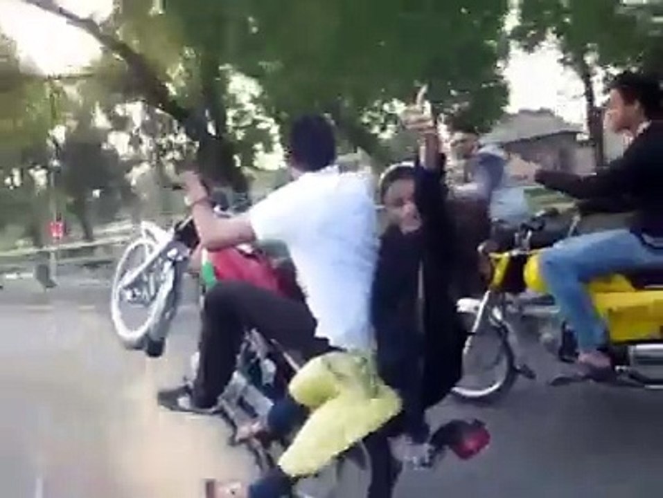 Girl and boy with 1 2 5 bike