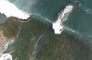 Drone Captures Playful Dolphins and Bodyboarders Riding Waves