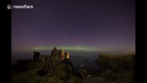 St Patricks Day Northern Lights above Irish castle