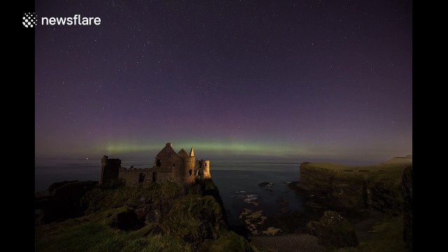St Patricks Day Northern Lights above Irish castle