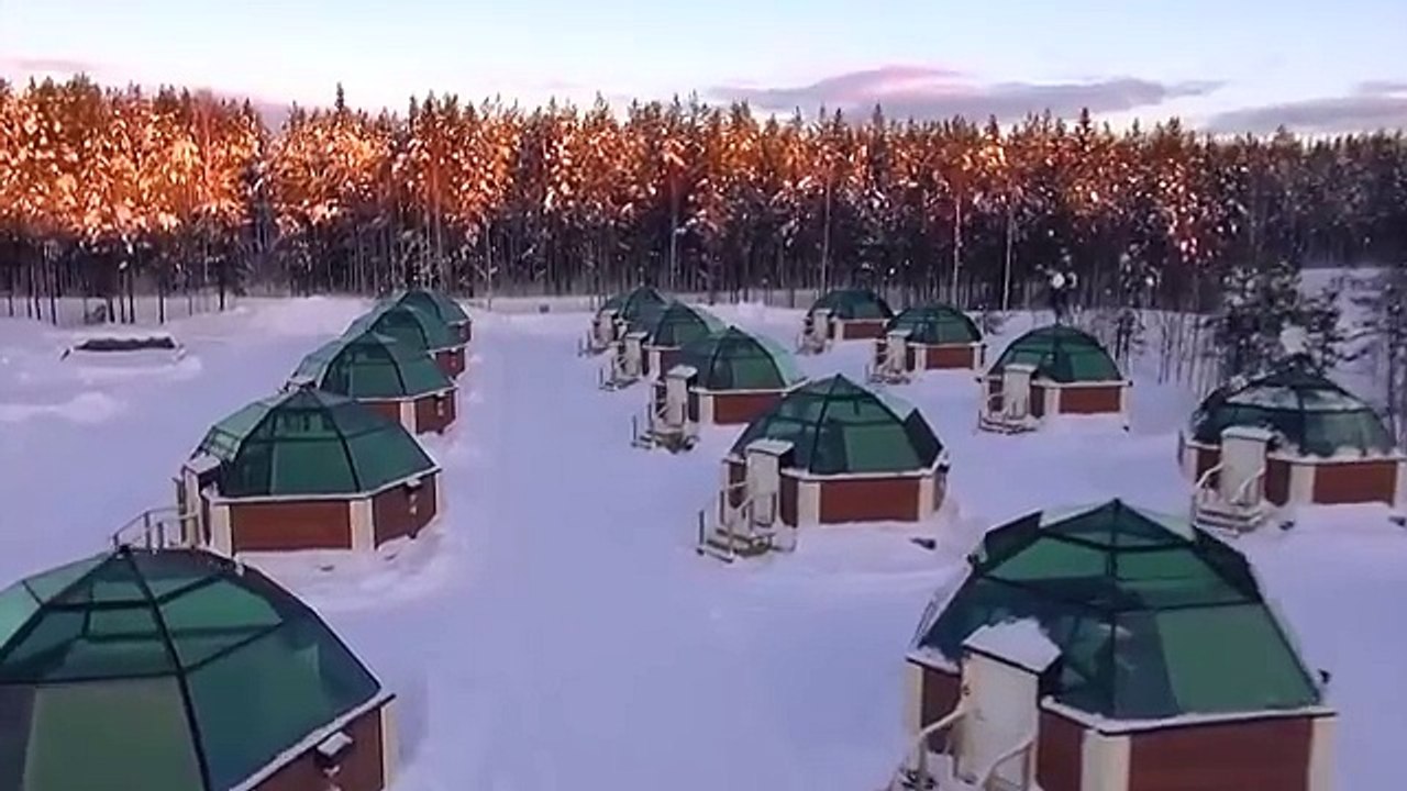 Discovering northern lights in Arctic Glass Igloos in Rovaniemi in Lapland Finland