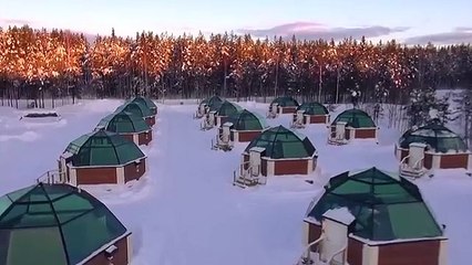 Discovering northern lights in Arctic Glass Igloos in Rovaniemi in Lapland Finland