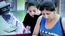 how girls theft mobile from a shop caught by camera