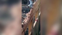 Terrifying moment Daredevil construction worker destroys wall he is standing on