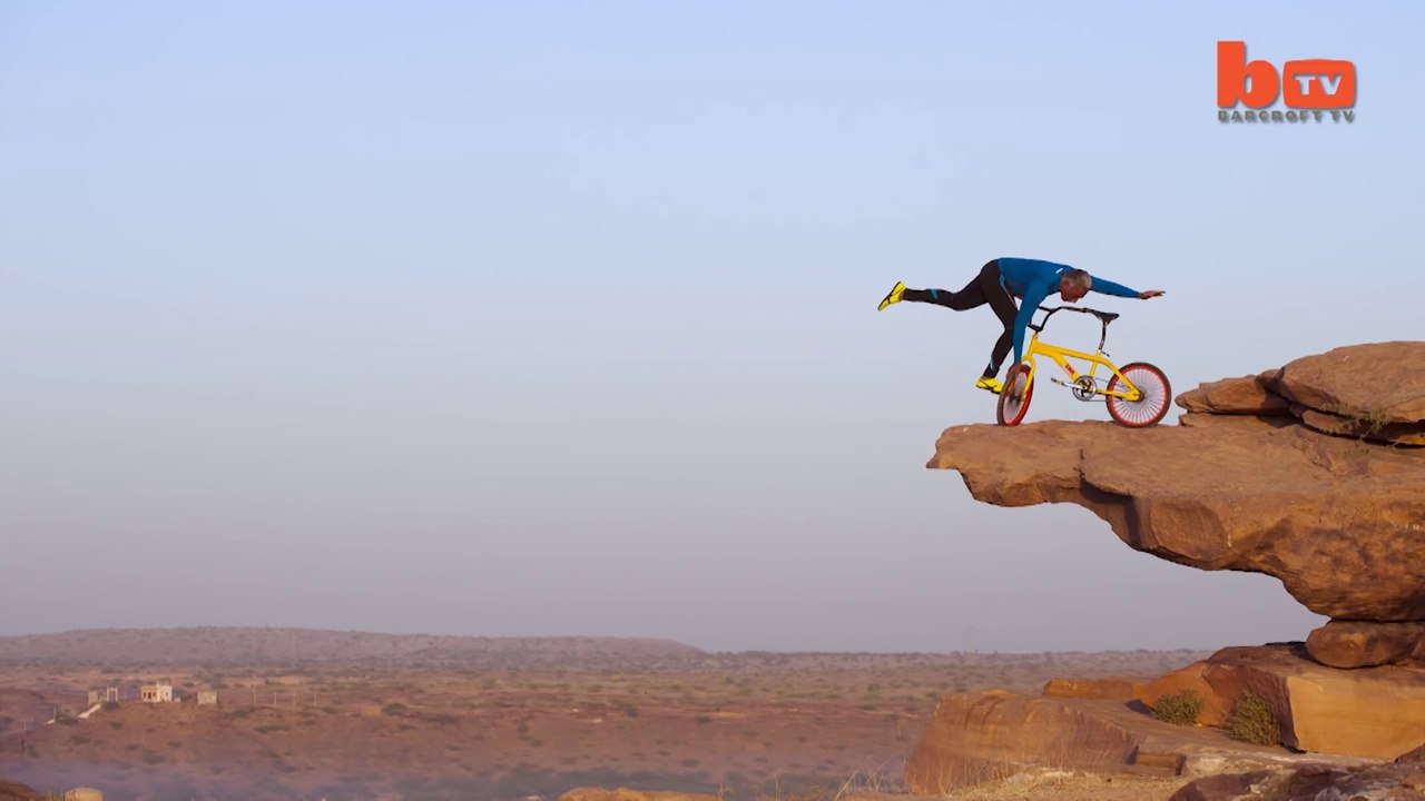 Clifftop BMX Yoga- Extreme 68-year-old Performs On Bike 300ft Above Ground