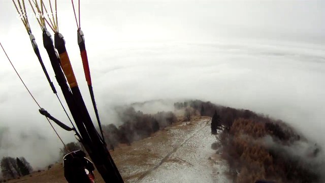 Breathtaking paraglide above a sea of clouds