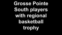 Grosse Pointe South players with regional basketball trophy