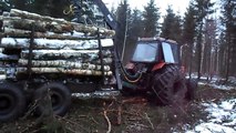 Belarus Mtz 1025 forestry tractor stands up, muddy off road