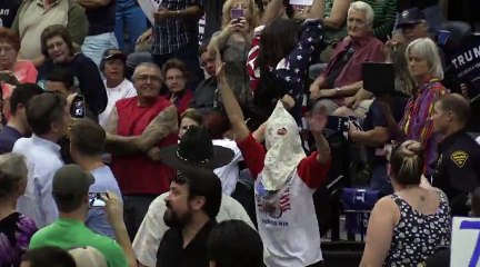 Man wearing Klan Outfit Disrupts Trump Rally and arrested by Police