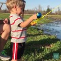 This little guy wasn't expecting to catch anything with his toy fishing rod...