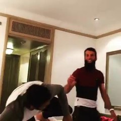 Adil Rashid and Moeen Ali Fielding with an apple.