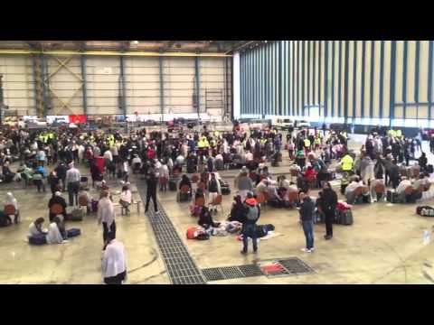 Hundreds Wait in Brussels Airport Hangar Following Blasts