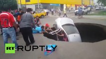 Giant sinkhole swallows car with family still inside in Peru