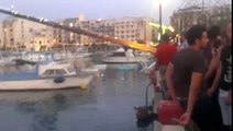 Ouch! Greasy pole climbing attempt ends between his legs