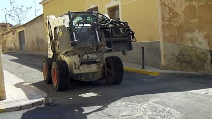 Bobcat S300 with road breaker attachment