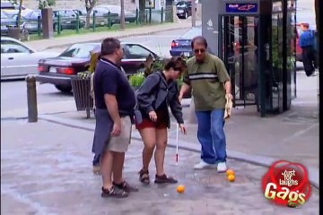 Blind man kicking oranges