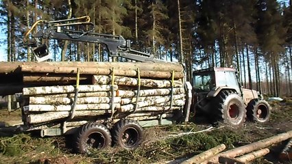 Valtra 6850 forestry tractor working in wet forest