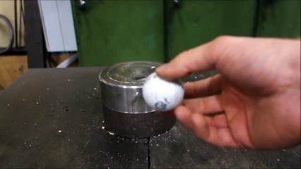 Crushing golf ball with hydraulic press