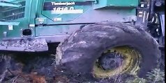 TDT 55 tractor stuck in deep mud, Timberjack 1010D helps, extreme mud conditions