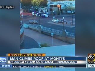 Man climbs roof of old Monti's