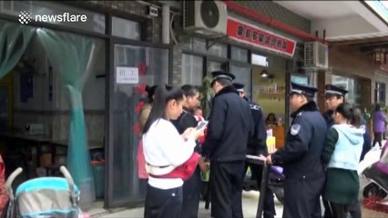 Man 'kisses' police officer TWICE during scuffle