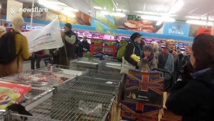 Flash mob suddenly start singing in UK supermarket