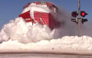 Train Plows Through Massive Snow Bank