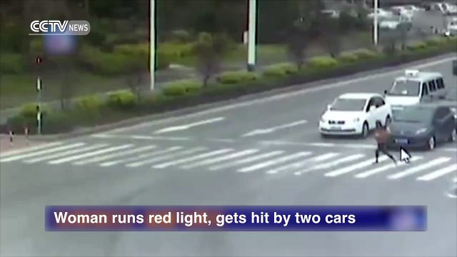 Woman runs red light, gets hit by two cars
