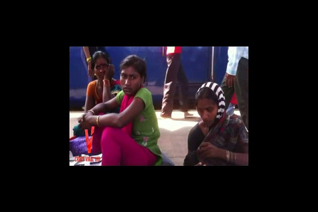 Indian Mother breastfeeding in public on train platform