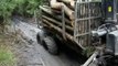 Belarus Mtz 1025 forestry tractor, punctured wheel in mud