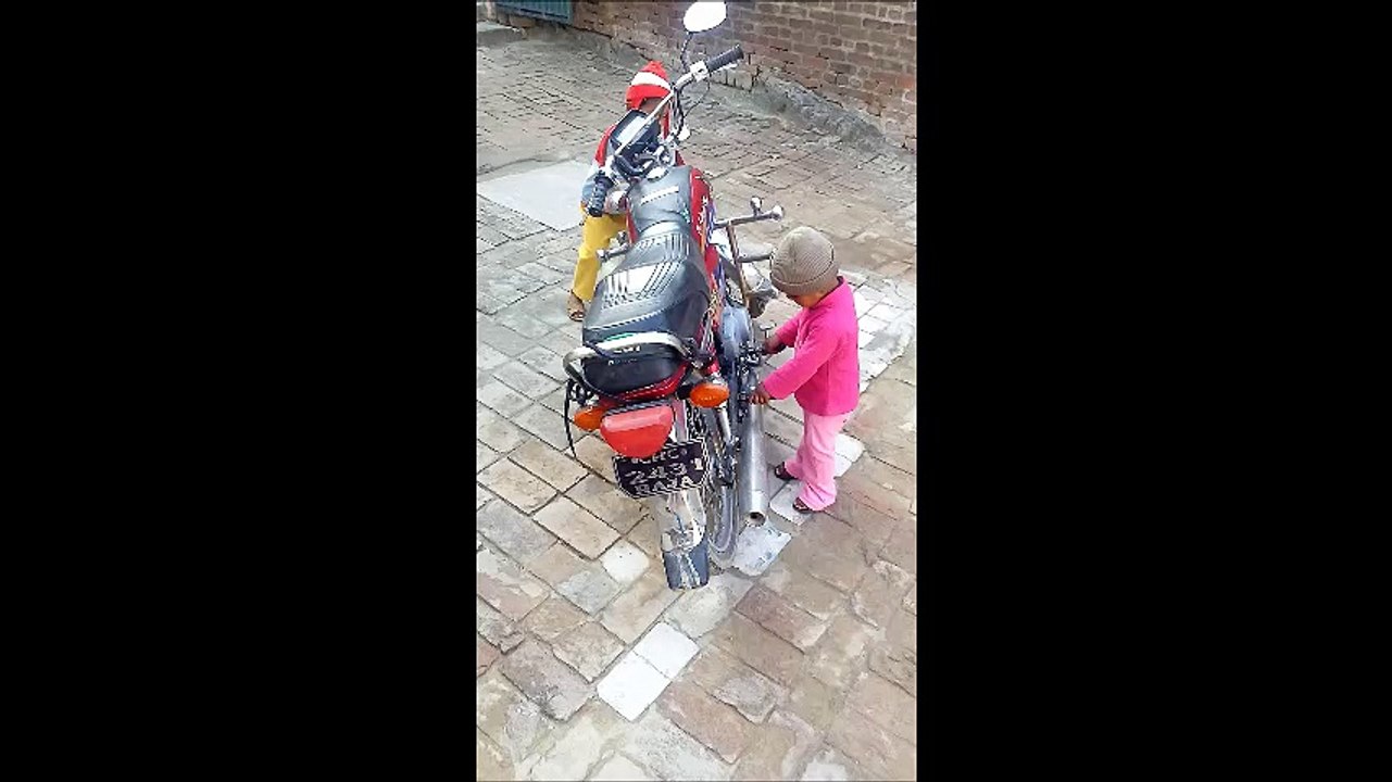Kids Playing with a Bike