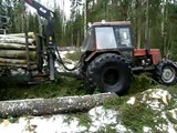Belarus Mtz 1025 forestry tractor working in wet forest