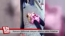 Karısını öldürmek isteyen adama saksı fırlattılar