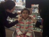 Taylor having her ears pierced