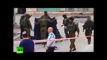 IDF soldier greets ultra-nationalist after injured Palestinian attacker killed