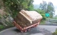 Overloaded Truck Fails To Make The Turn